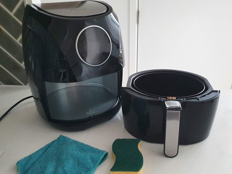 How do you clean baked-on grease out of an air fryer
