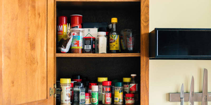 Where is the best place to store spices in the kitchen