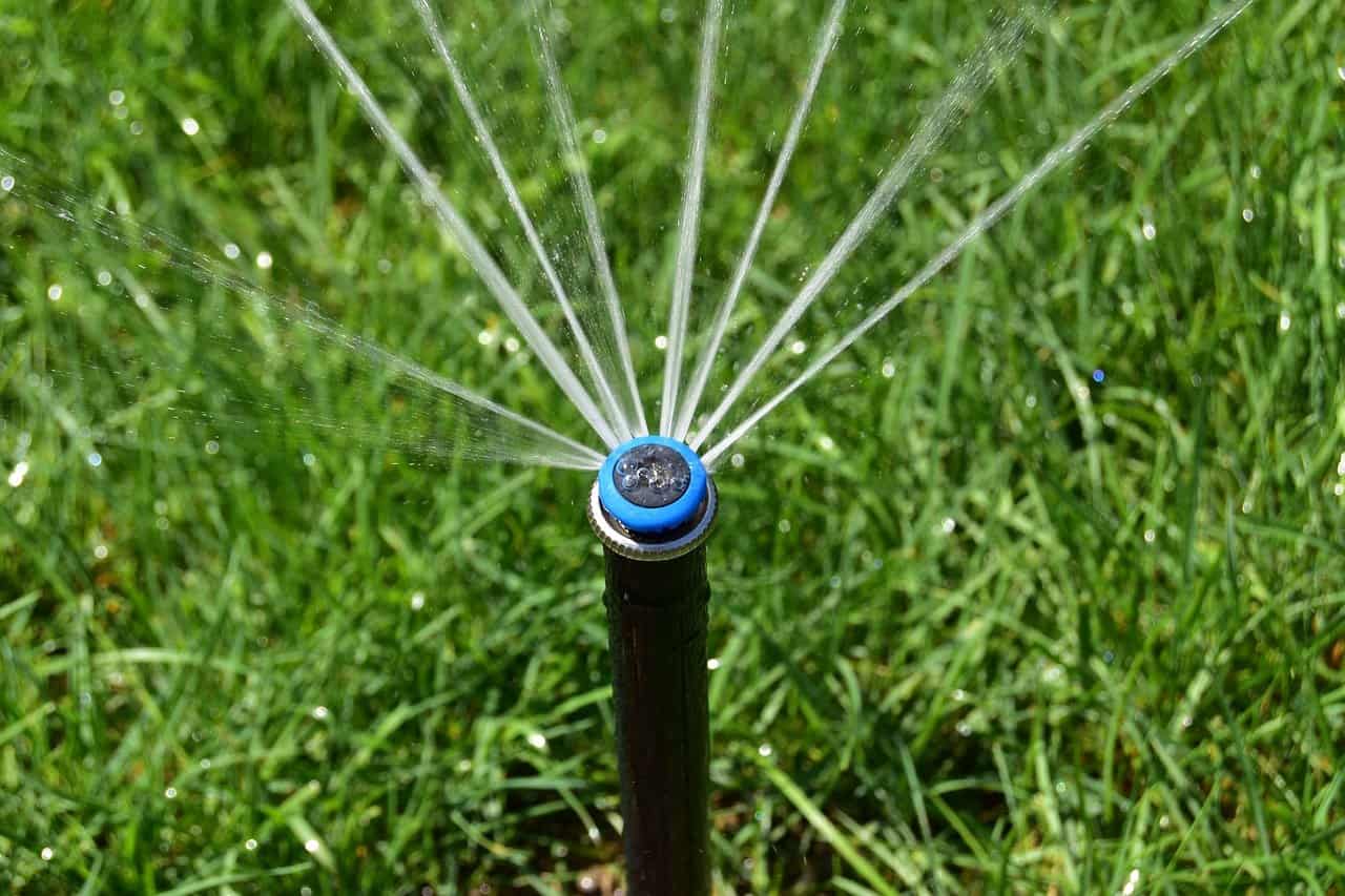 Why is it important to blow out sprinkler lines?